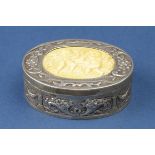 An 18th Century silver and ivory Snuff Box of oval form, the hinged cover inset with carved ivory