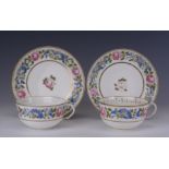 A pair of Swansea porcelain Teacups and Saucers, circa 1815-1818, decorated with a continuous band