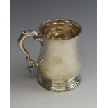 A George II silver baluster Pint Mug with leafage scroll handle, London 1752, maker: Henry