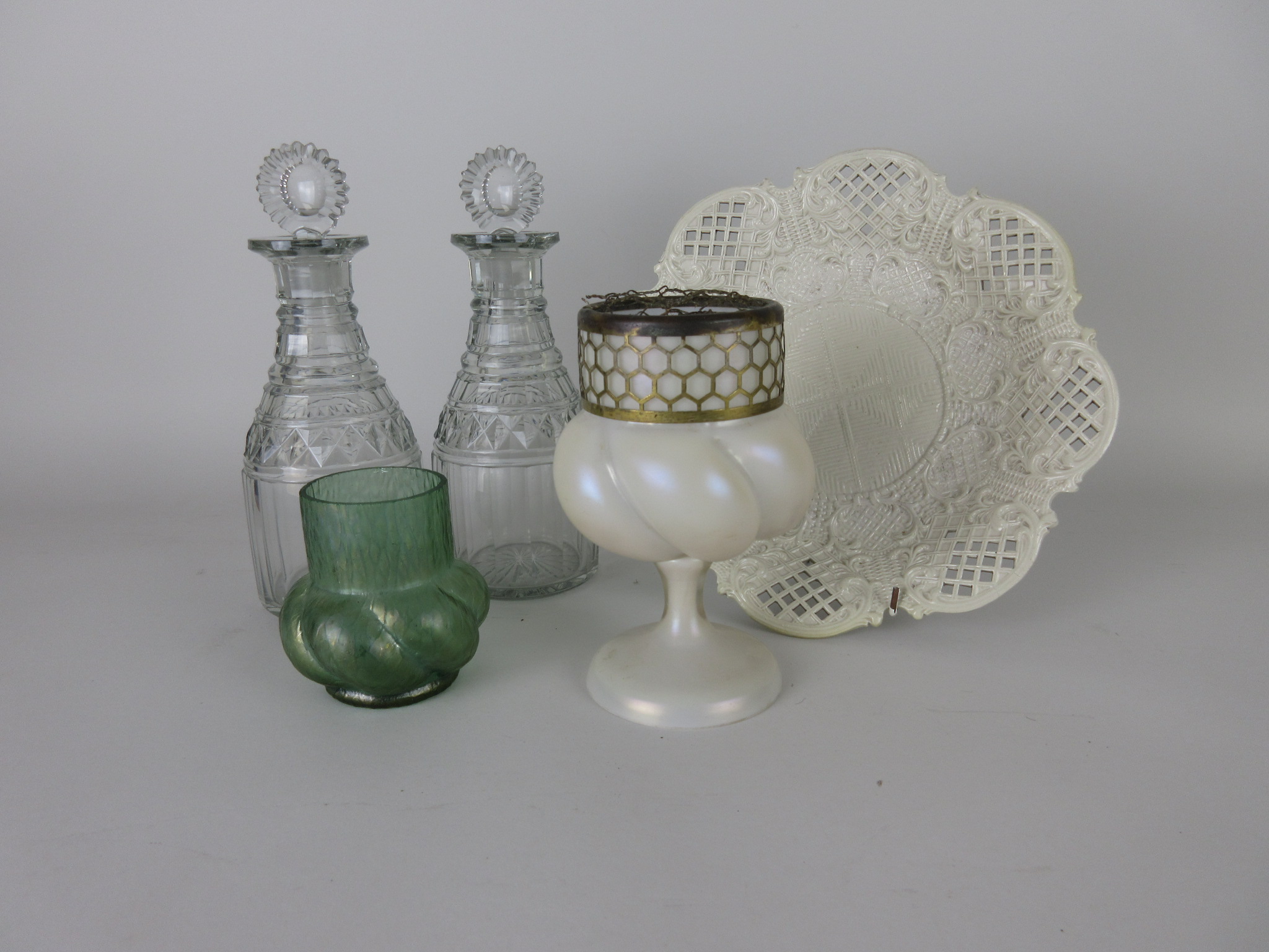 A pair of Georgian cut glass Decanters with target stoppers, 9 1/2in H (chipped rims), two