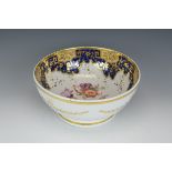 A Ridgway Punch Bowl, the interior painted floral designs, the inner edge with blue and gilt border,