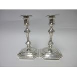 A pair of Edward VII silver Candlesticks with knop stems on square bases with inverted corners,