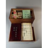 A Cased 1930's Mah Jong Set with Tiles, Counters and Instruction Book.