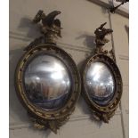 A Pair of 19th Century Gilt Framed Circular Convex Wall Mirrors with Eagle pediments,