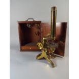 A Cased Lacquered Brass Microscope by Armstrong and Bro, 88 Deansgate, Manchester with 2 Lens.