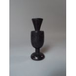 A 19th Century Irish Bog Oak Spill Vase with Typical Carved Decoration.