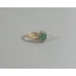 A 9ct Gold Diamond and Emerald Ladies Dress Ring,