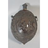 An Early 19th Century Carved Coconut Bugbear Powder Flask Decorated in Relief with Three Cartouches