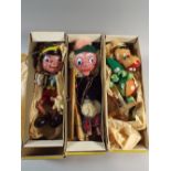 A Collection of Three Boxed Pelham Standard Puppets. Pinocchio, Mr Boozle and Baby Dragon.