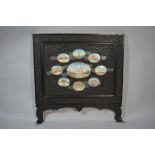 An Anglo Indian Finely Carved Ebonised Table Screen with Inset Oval Painted Ivory Panels Depicting