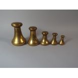 A Graduated Set of Five Brass Bell Weights by Avery.