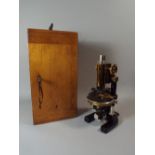 A Lacquered Brass and Black Enamelled Microscope by C. Reichart, Wien Number 63940.