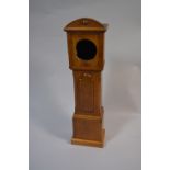 A 19th Century Oak Clock Case in the Form of a Miniature Long Case Clock.