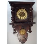 A Late 19th / Early 20th Century Continental Oak Wall Clock with Brass Pendulum Decorated with