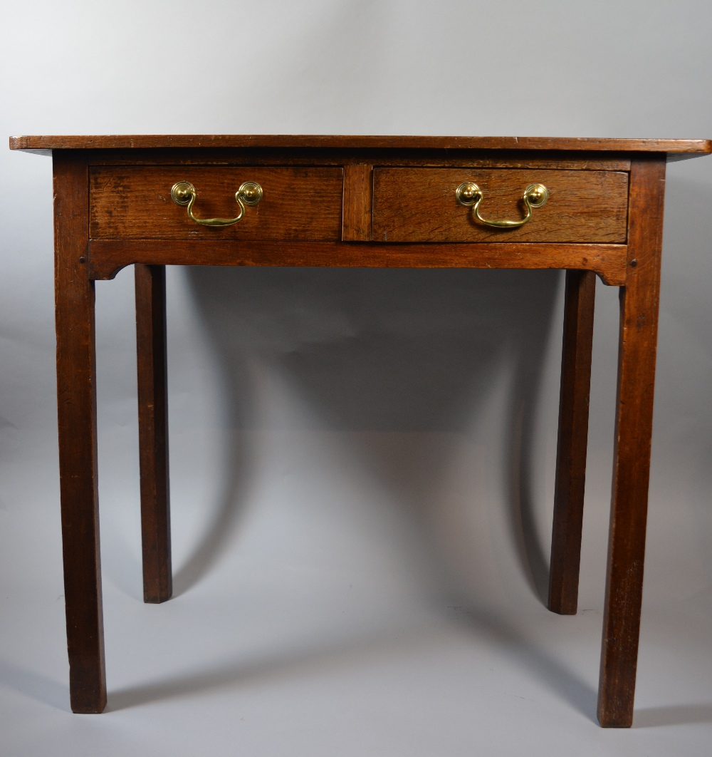 A 19th Century Oak Two Drawer Side Table with Inner Chamfered Supports Brass Drop Handles