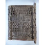 A Carved Wooden West African Dogon (Mali) Granary Door with Sliding Lock and Decorated with Figures,