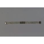 A Diamond and Pearl Bracelet with 18 Carat White Gold Clasp. Stamped 750. 19cm Long. 22.9gms.