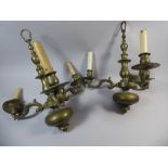 A Pair of Heavy Three Branch Brass Chandeliers with Turned Column and Scrolling Branches.