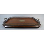 An Edwardian Oak Two Handled Butlers Tray. Pierced and Silver Plated Gallery and Centre Cartouche.