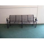 A Wrought Iron Garden Seat with Scrolled Arms. 83cm Wide.