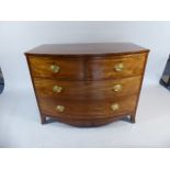 A Small Victorian Mahogany Bow Fronted Chest of Two Short and Two Long Drawers on Bracket Feet.