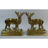 A Pair of Brass Door Stops Depicting Stags on Naturalistic Ground and Stepped Base.
