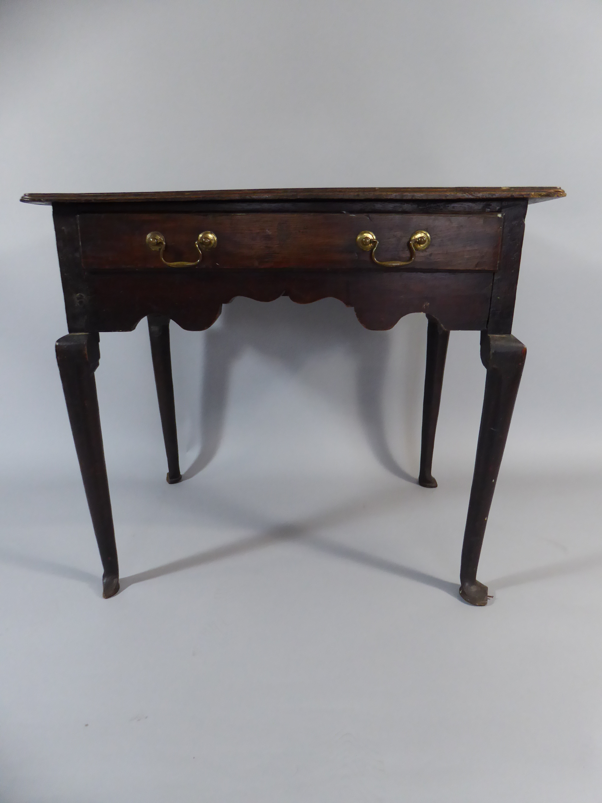 A 19th Century Oak Side Table with Single Drawer on Cabriole Legs.