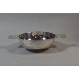 A Large Silver Quaish with Two Handles, 14.5cms Diameter.