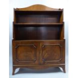A Reproduction Mahogany Waterfall Bookcase with Panelled Doors to Cupboard Base and Bracket Feet.