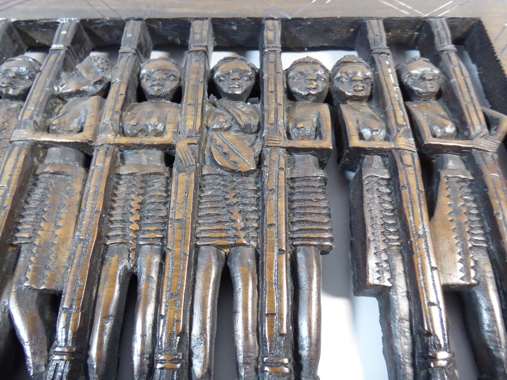 A Carved Wooden African Panel Depicting Twelve Topless Maidens Behind Bars. - Image 3 of 5