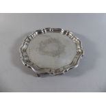 A Circular Silver Card Tray with Piecrust Border and Three Scrolled Feet. Birmingham 1912.