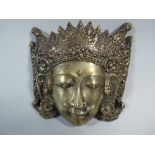 An Indonesian Small Cast Brass Dancing Girl Mask. 13x12cms.