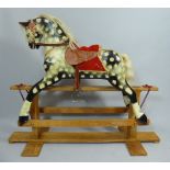 A 20th Century Dapple Grey Rocking Horse on Wooden H Frame by Collinsons of Liverpool