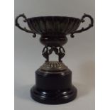 A Spanish White Metal Two Handled Trophy with Ribbed Body and Swan Supports.