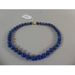 A String of Lapis Lazuli Beads with 18ct Yellow Gold Clasp