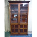 An Edwardian Library Bookcase with Panelled Doors to Cupboard Base and Glazed Top Section with Four
