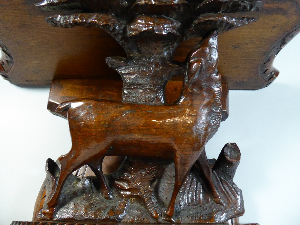 A Black Forest Wall Shelf with Carved Decoration depicting Walnuts and Female Red Deer Beside Tree. - Image 3 of 3