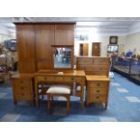 A Contemporary Five Piece Cherry Wood Bedroom Suite Comprising Triple Wardrobe,