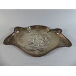 A Silver Dressing Table Tray with Embossed Cherub Decoration.
