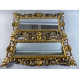 A Pair of Good Victorian Pierced and Gilt Wood Mirrors.