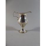 A Georgian Silver Jug on Turned Foot, 12.5cm High. 81 gms. London 1784 by John Lambe.