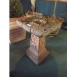 A Reconstituted Stone Tree Trunk Bird Bath,