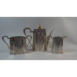 A Silver Three Piece Tea Service with Etched decoration by Walker and Hall.