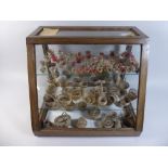 An Edwardian Glazed Oak Display Case Containing a Quantity of Various Chilean Woven Miniature