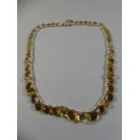 A Citrine and Seed Peal Collar Necklace Comprising 49 Graduated Ovoid Cut Citrines (Largest 1.5x1.