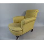 A 19th Century Country House Upholstered Club Chair in the Style of Howard and Sons.