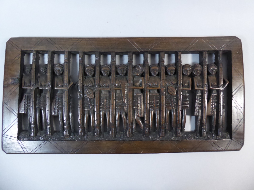 A Carved Wooden African Panel Depicting Twelve Topless Maidens Behind Bars. - Image 2 of 5