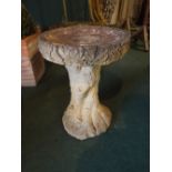 A Reconstituted Square Bird Bath on Terracotta Support