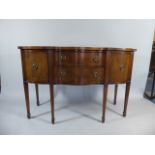 A Mahogany Georgian Style Serpentine Front Sideboard with Two Centre Drawers.