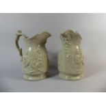 A Pair of Glazed Stoneware Tavern Jugs with Mask Heads
